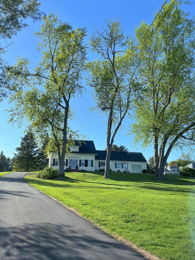544 Main Rd N, Hampden, ME 04444 - view of front facade featuring a front yard and an attached garage