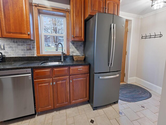 544 Main Rd N, Hampden, ME 04444 - kitchen with stainless steel appliances, a sink, backsplash, brown cabinets, and ornamental molding
