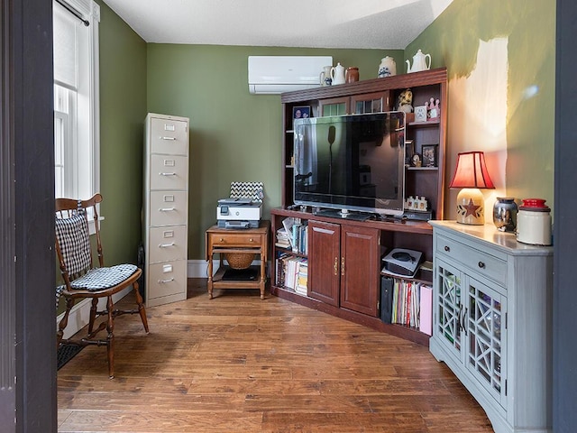 544 Main Rd N, Hampden, ME 04444 - living room with a wall mounted AC and wood finished floors