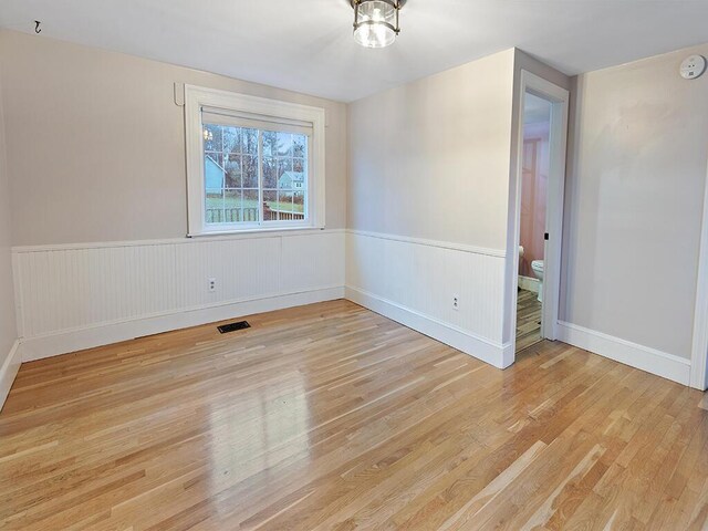 544 Main Rd N, Hampden, ME 04444 - unfurnished room with light wood-type flooring and wainscoting