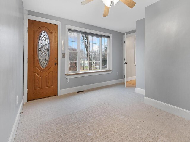 544 Main Rd N, Hampden, ME 04444 - foyer entrance with ceiling fan, light carpet, and baseboards