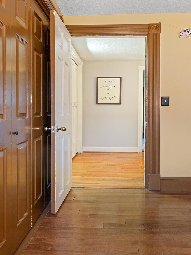 544 Main Rd N, Hampden, ME 04444 - hall with baseboards and wood finished floors