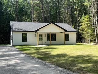0 Parsons Rd, Norway, ME 04268 - view of front facade with a front yard, driveway, and a wooded view