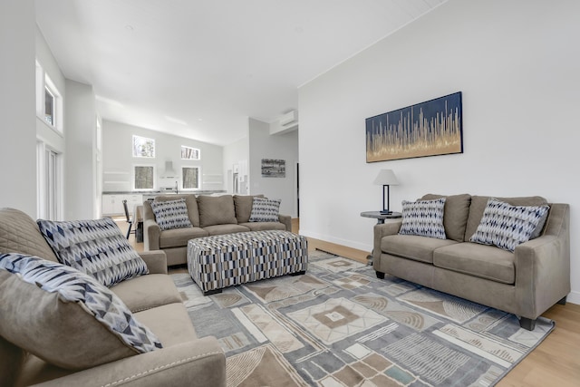 living room with wood finished floors and baseboards