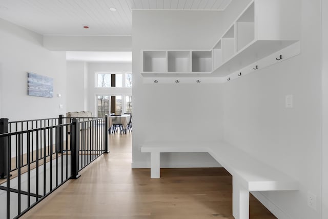 mudroom with wood ceiling, baseboards, and wood finished floors