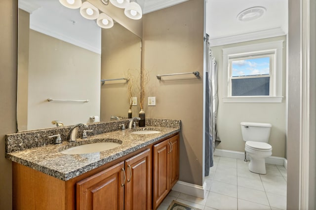 bathroom with tile patterned floors, toilet, vanity, and ornamental molding