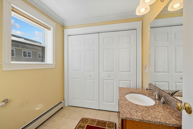 bathroom featuring vanity, tile patterned floors, baseboard heating, and crown molding