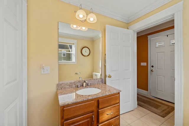 bathroom with tile patterned flooring, vanity, and crown molding