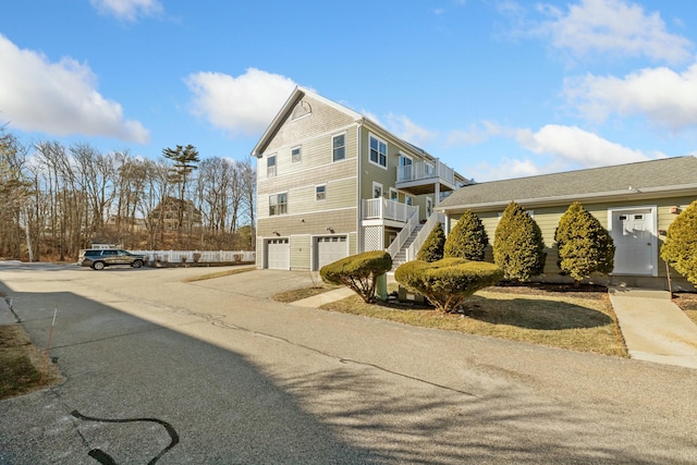 view of side of property with a garage