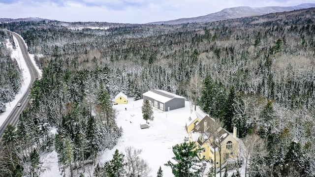 snowy aerial view with a mountain view