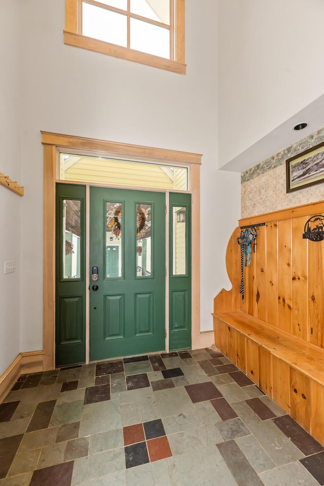 entryway featuring a towering ceiling