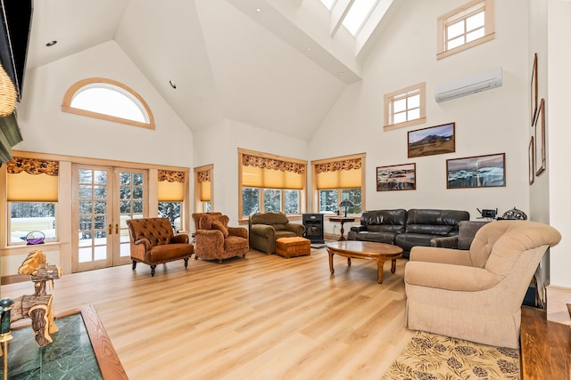 living room featuring a wall unit AC, french doors, and high vaulted ceiling