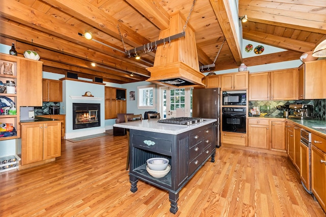 kitchen with decorative backsplash, black appliances, light hardwood / wood-style flooring, wooden ceiling, and a kitchen island