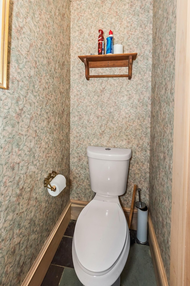 bathroom with tile patterned floors and toilet