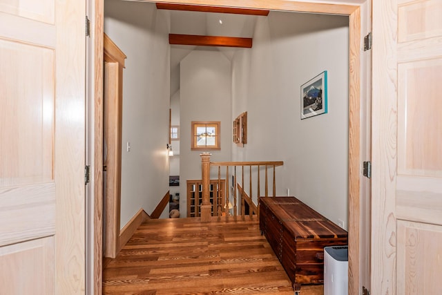 hall featuring beamed ceiling