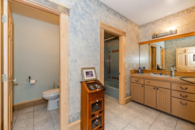 bathroom featuring tile patterned floors, vanity, and toilet