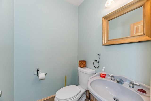 bathroom with toilet and sink