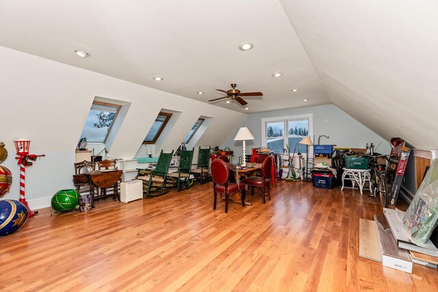 interior space with hardwood / wood-style floors, vaulted ceiling, and ceiling fan