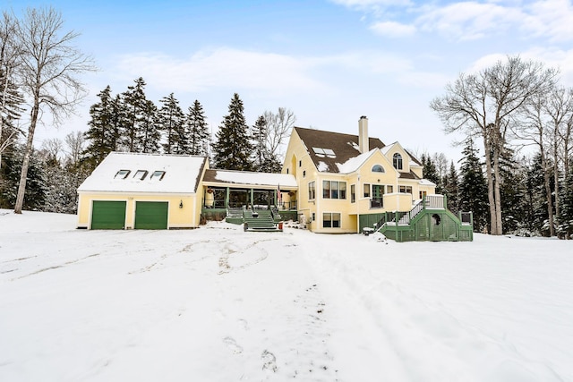 exterior space with an outbuilding and a garage