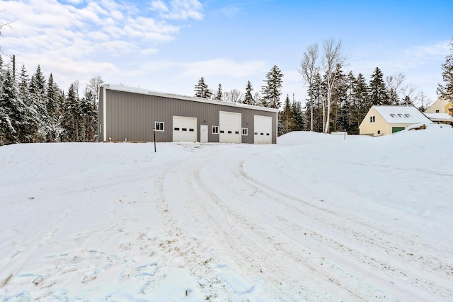 view of snow covered garage