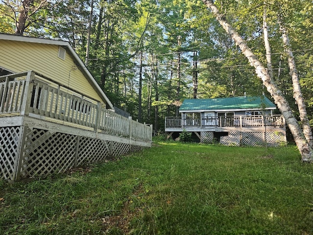 view of yard with a wooden deck