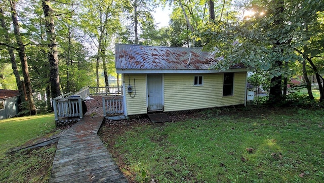 view of outbuilding featuring a yard