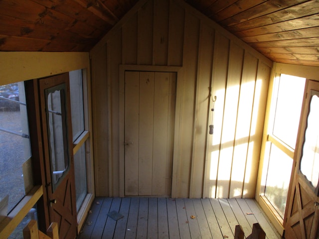 exterior space featuring wooden ceiling and vaulted ceiling