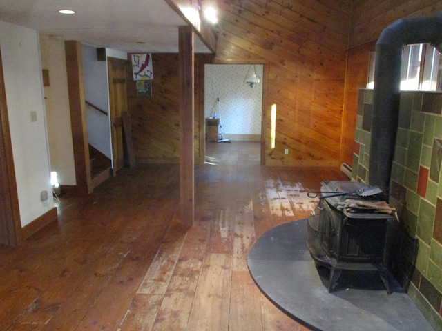 hallway featuring wood walls and hardwood / wood-style flooring