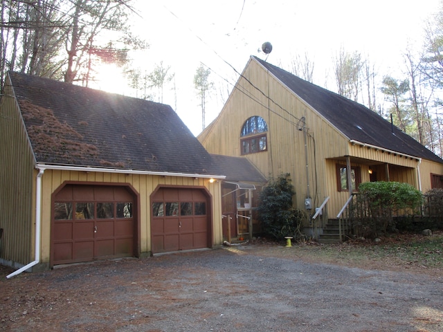 view of side of property featuring a garage