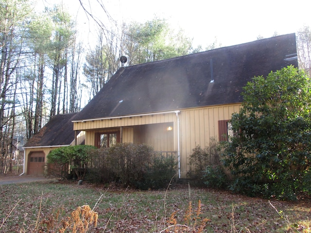 view of property exterior featuring a garage