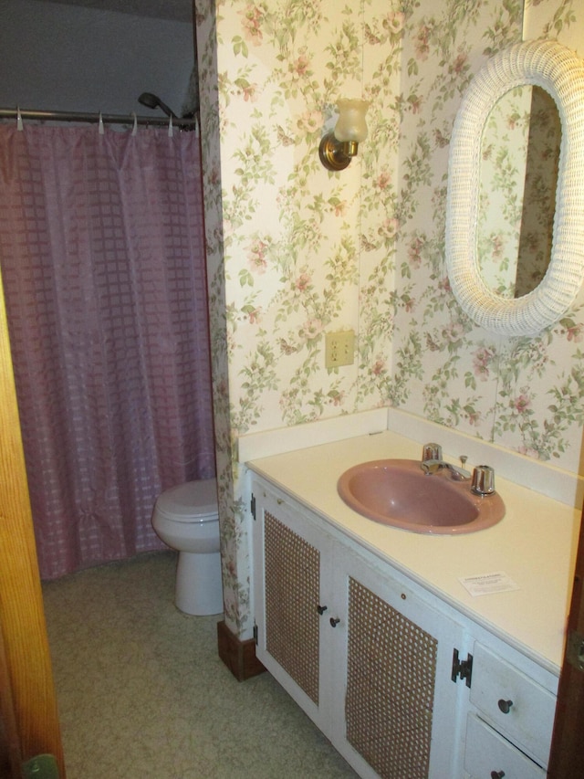 bathroom with vanity and toilet