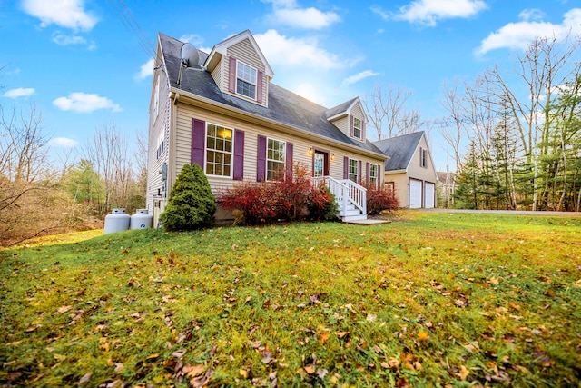 cape cod home featuring a front lawn