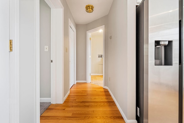 corridor featuring light hardwood / wood-style floors