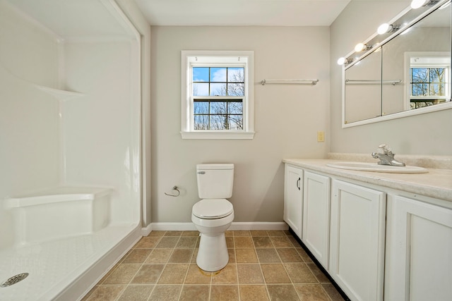 bathroom with tile patterned floors, vanity, and toilet