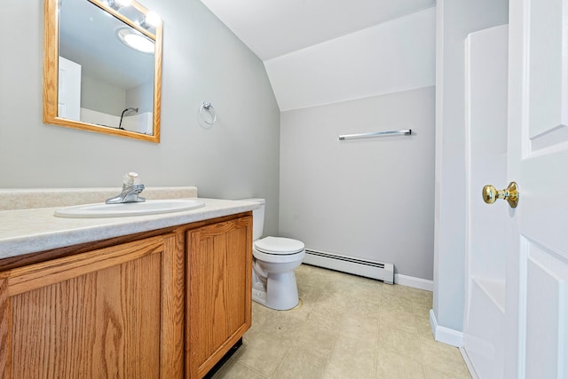 bathroom with vanity, a baseboard radiator, vaulted ceiling, and toilet