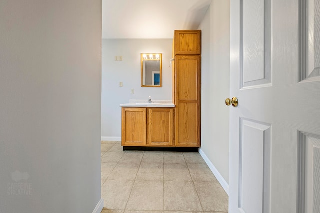 bathroom featuring tile patterned floors and vanity