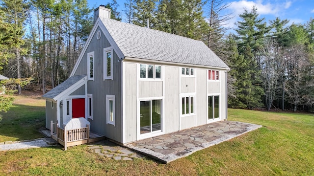 view of outbuilding featuring a lawn