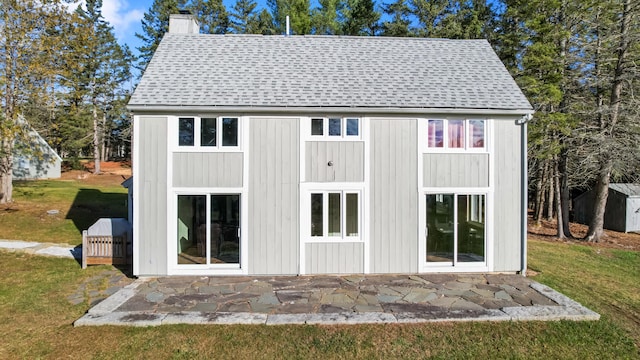 exterior space with a yard and a storage unit