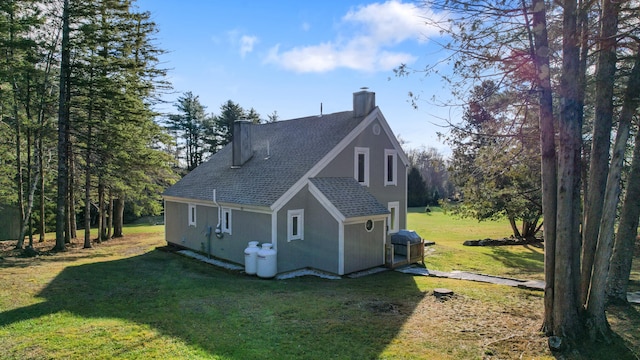 view of home's exterior with a yard