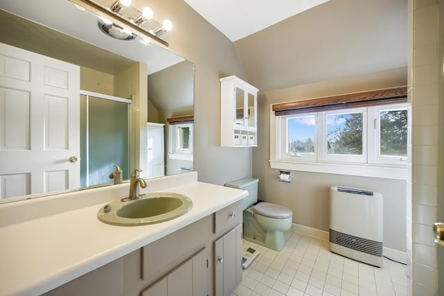 bathroom with vanity, lofted ceiling, tile patterned flooring, an enclosed shower, and heating unit