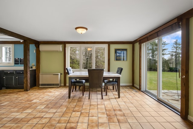 dining area with a wall mounted AC, radiator heating unit, and a wealth of natural light