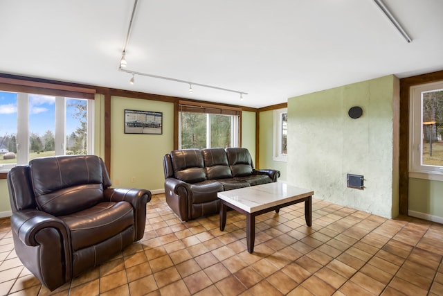 living room featuring light tile patterned floors and track lighting