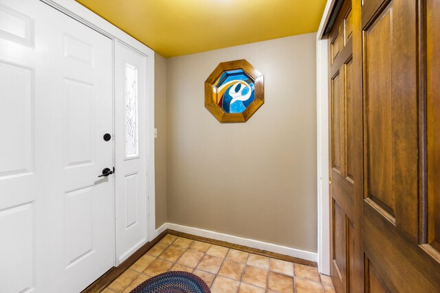 foyer with light tile patterned floors