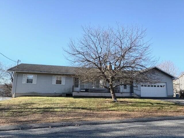 single story home featuring a garage and a front lawn