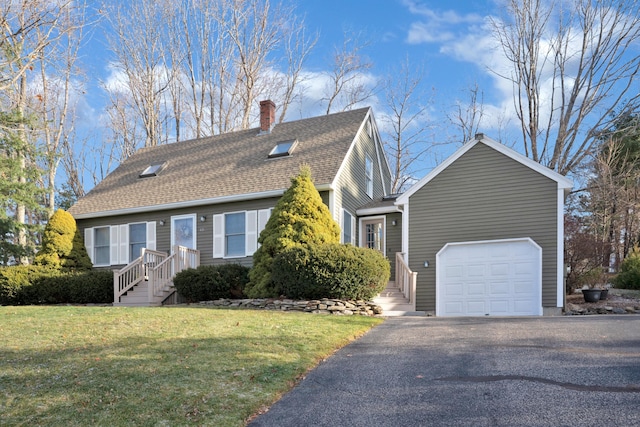 view of front of property with a front yard and a garage