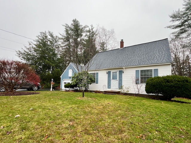 view of front of property featuring a garage and a front yard