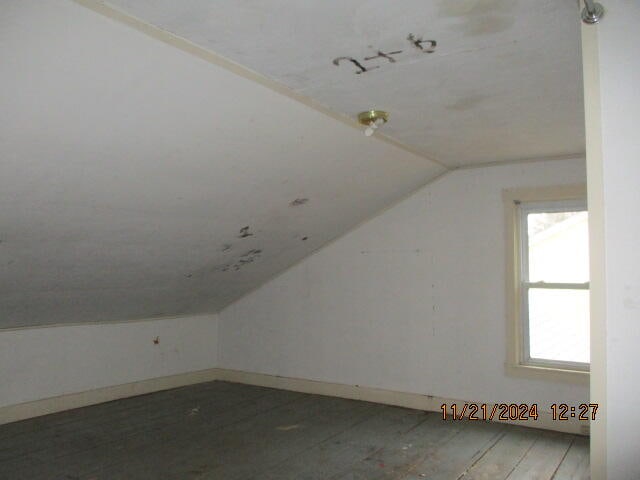 bonus room featuring lofted ceiling