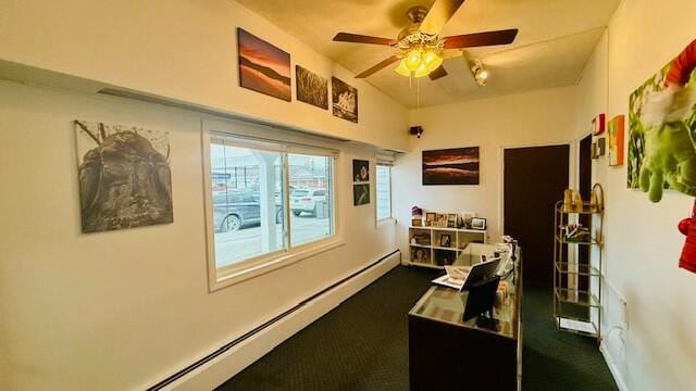 carpeted office space featuring ceiling fan and a baseboard radiator