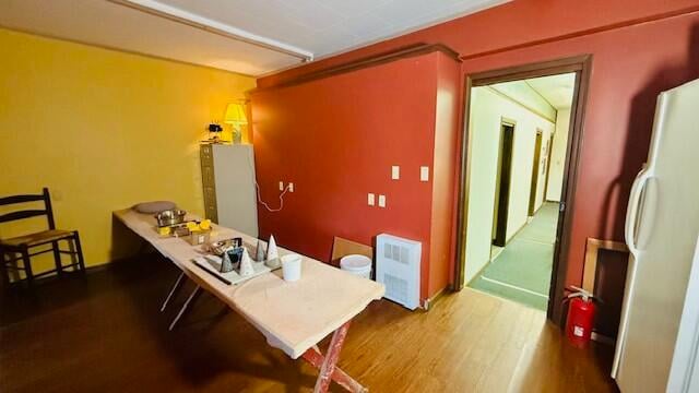 dining room with wood-type flooring