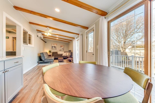 dining space with a wall mounted air conditioner, lofted ceiling with beams, ceiling fan, and light hardwood / wood-style flooring